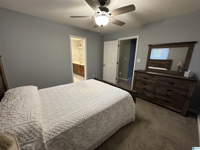 bedroom featuring a textured ceiling, carpet floors, ceiling fan, and ensuite bathroom