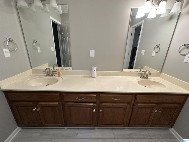 bathroom with tile patterned flooring and vanity