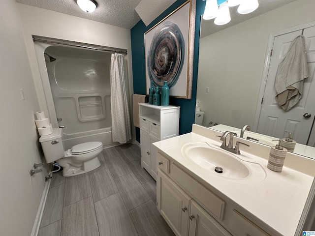 full bathroom with vanity, shower / bath combination with curtain, a textured ceiling, and toilet