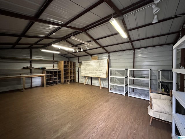 garage featuring wood walls