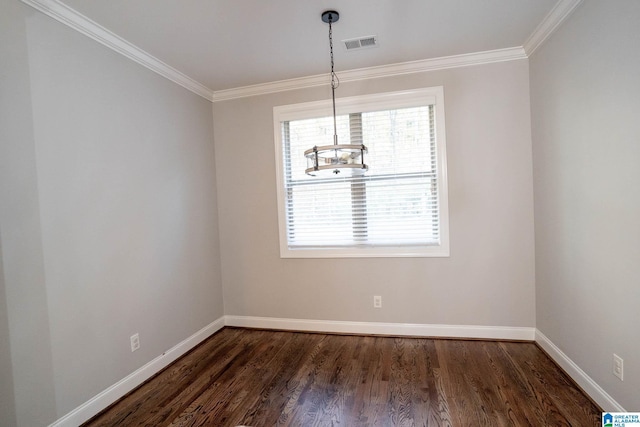 unfurnished dining area with dark hardwood / wood-style flooring, ornamental molding, and an inviting chandelier