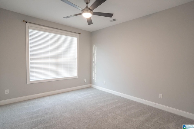 carpeted empty room with ceiling fan