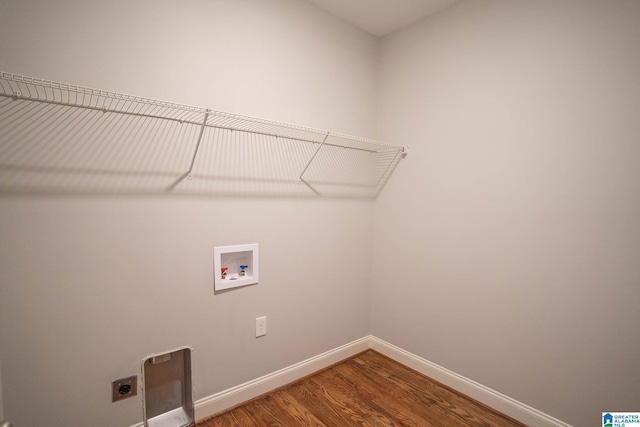 laundry room featuring hookup for an electric dryer, washer hookup, and hardwood / wood-style flooring