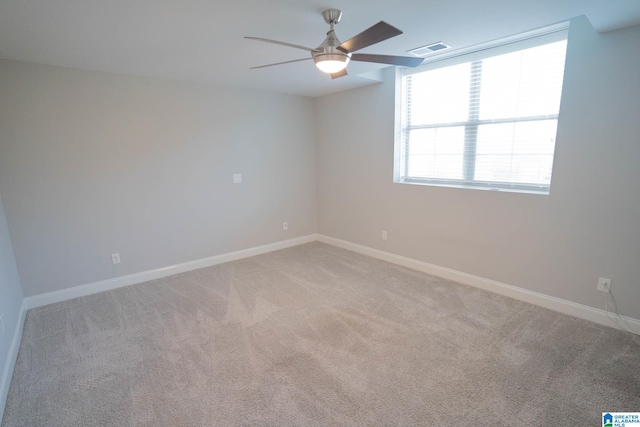 carpeted empty room with ceiling fan