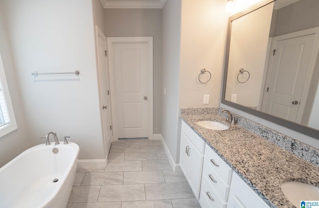 bathroom with a washtub and vanity