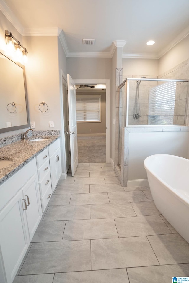 bathroom featuring vanity, crown molding, and plus walk in shower