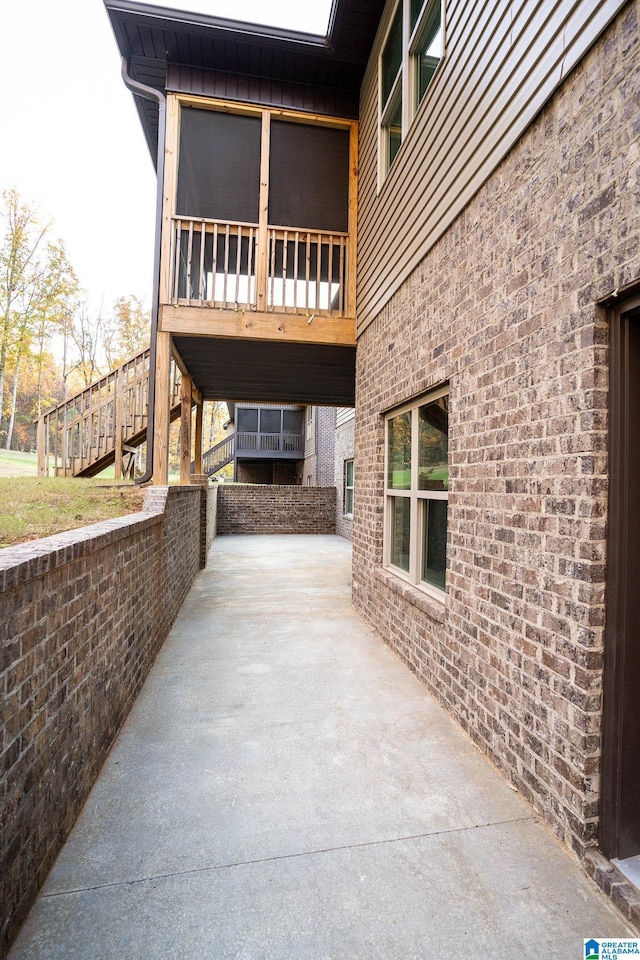 view of side of home with a patio area