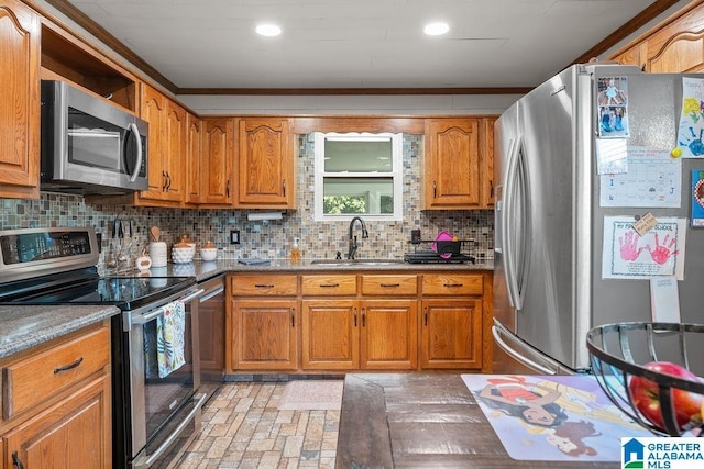 kitchen with tasteful backsplash, sink, and stainless steel appliances