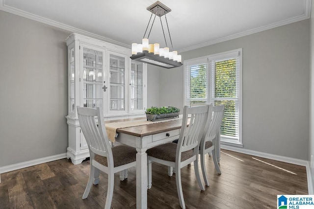 dining area featuring crown molding, dark hardwood / wood-style flooring, and an inviting chandelier