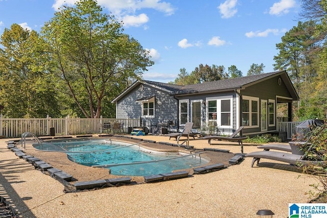 view of swimming pool with a patio