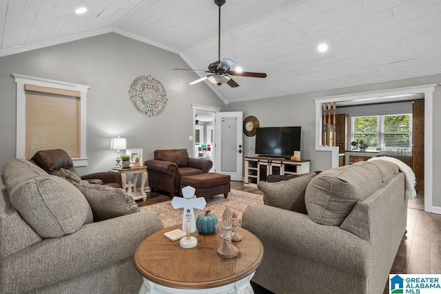 living room featuring ornamental molding, hardwood / wood-style flooring, and lofted ceiling