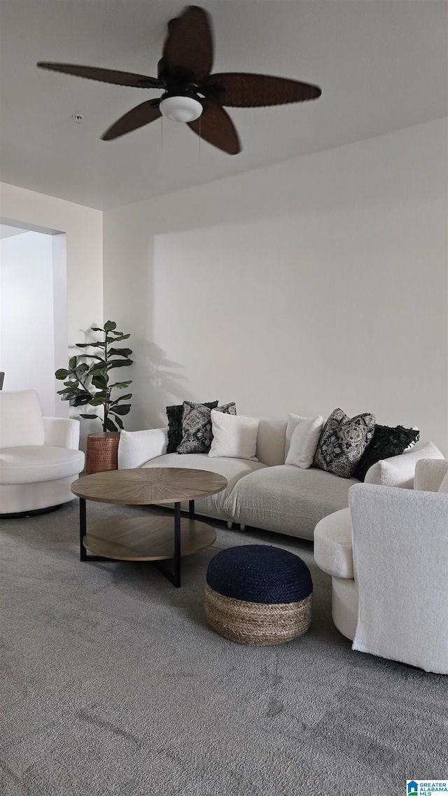 carpeted living room with ceiling fan