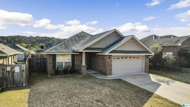 view of front of home with a front yard and a garage