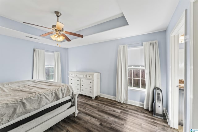 bedroom featuring ceiling fan and dark wood-type flooring