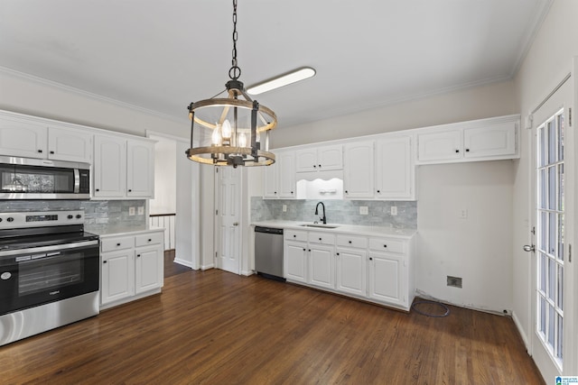 kitchen with decorative light fixtures, white cabinetry, stainless steel appliances, and dark wood-type flooring