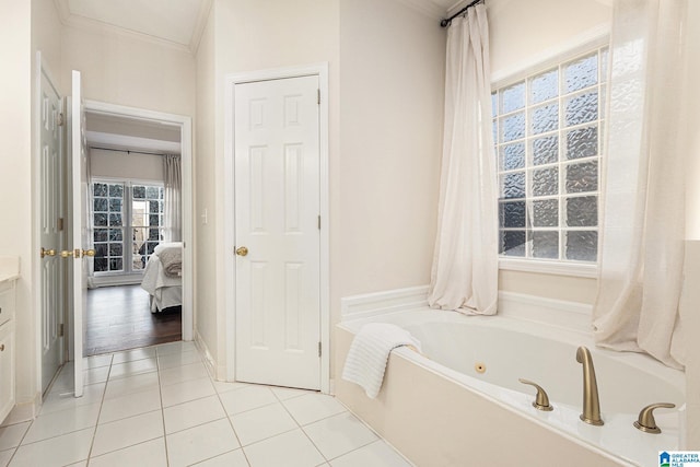 169 Glen Abbey Way, Alabaster, AL 35007 - bathroom with a whirlpool tub, tile patterned flooring, crown molding, ensuite bath, and vanity