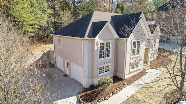 view of side of property with a garage