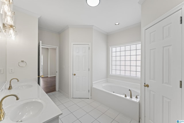 bathroom featuring a bathing tub, crown molding, tile patterned flooring, and vanity