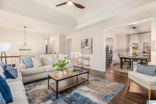 169 Glen Abbey Way, Alabaster, AL 35007 - living room with wood finished floors, a chandelier, a ceiling fan, baseboards, and crown molding