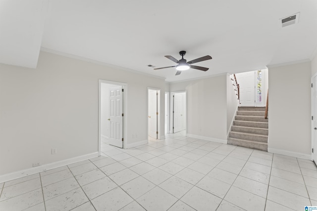 tiled empty room with ceiling fan and ornamental molding