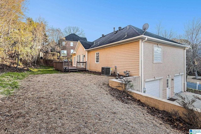 169 Glen Abbey Way, Alabaster, AL 35007 - rear view of house with an attached garage, a wooden deck, driveway, and central AC unit