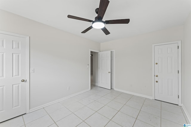 tiled empty room with ceiling fan