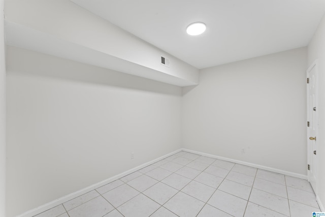 spare room featuring light tile patterned floors