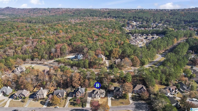 169 Glen Abbey Way, Alabaster, AL 35007 - aerial view of property and surrounding area with a heavily wooded area and nearby suburban area