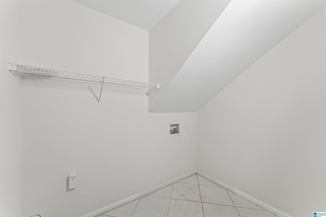 laundry area with light tile patterned flooring and washer hookup