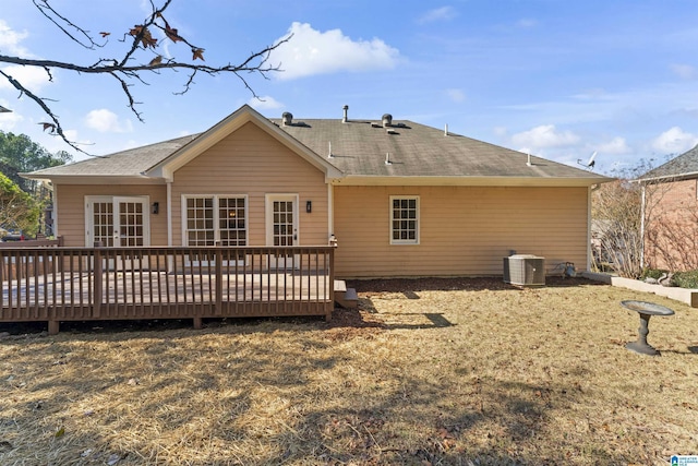 rear view of house featuring cooling unit and a deck