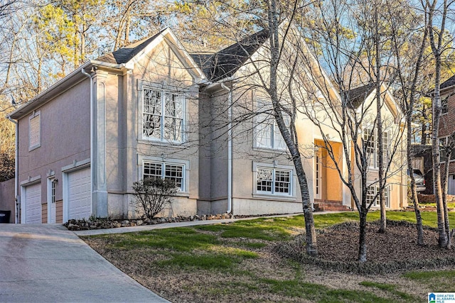 169 Glen Abbey Way, Alabaster, AL 35007 - view of front facade with stucco siding, driveway, and a garage