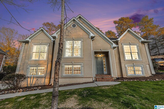 169 Glen Abbey Way, Alabaster, AL 35007 - view of front of property with stucco siding and a lawn