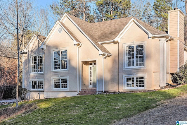 169 Glen Abbey Way, Alabaster, AL 35007 - traditional-style home with a chimney, a front lawn, stucco siding, and a shingled roof