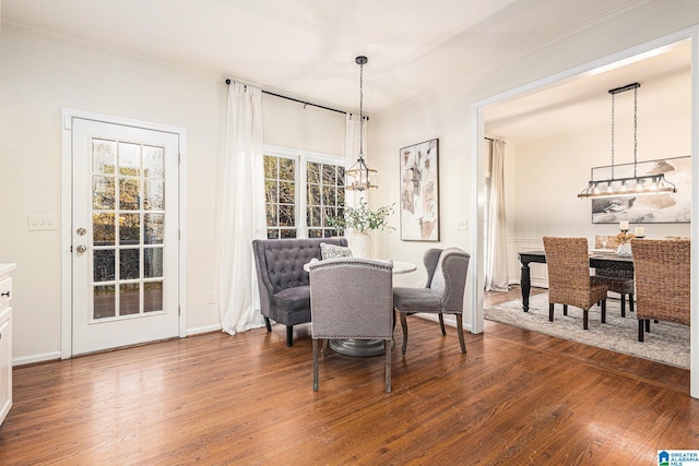 169 Glen Abbey Way, Alabaster, AL 35007 - dining area with wood finished floors, a chandelier, ornamental molding, and baseboards