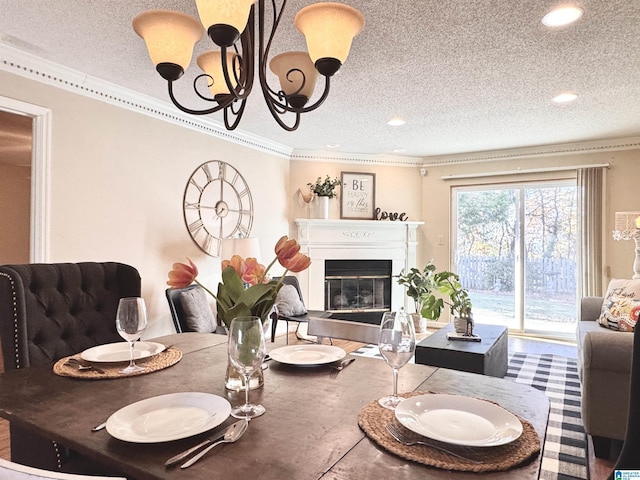 dining area with a textured ceiling and ornamental molding