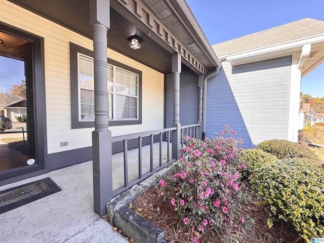 view of exterior entry with a porch