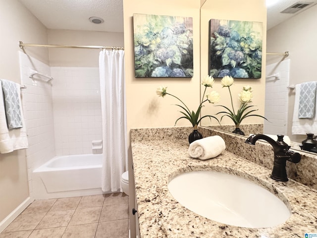 full bathroom featuring vanity, tile patterned floors, toilet, a textured ceiling, and shower / tub combo