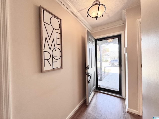 doorway to outside with crown molding and wood-type flooring