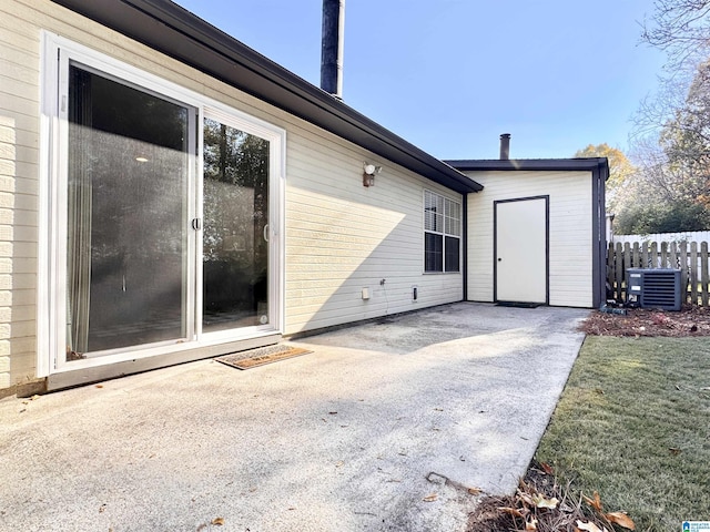 exterior space featuring a yard, a patio, and central AC