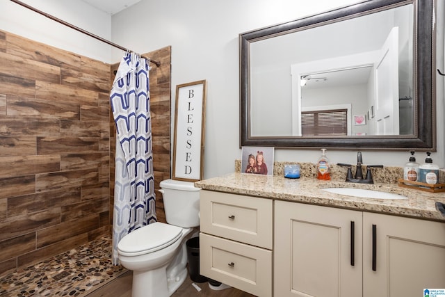 bathroom featuring hardwood / wood-style flooring, vanity, toilet, and a shower with curtain