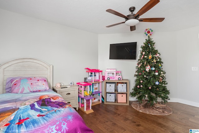 bedroom featuring a textured ceiling, ceiling fan, and dark wood-type flooring