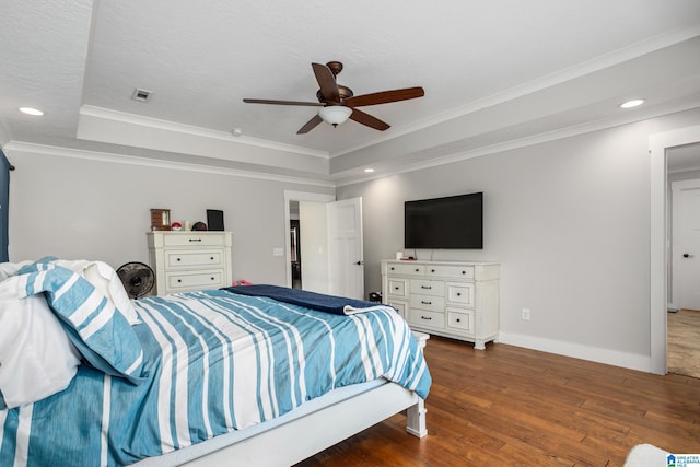 bedroom featuring ceiling fan, dark hardwood / wood-style flooring, crown molding, and a textured ceiling