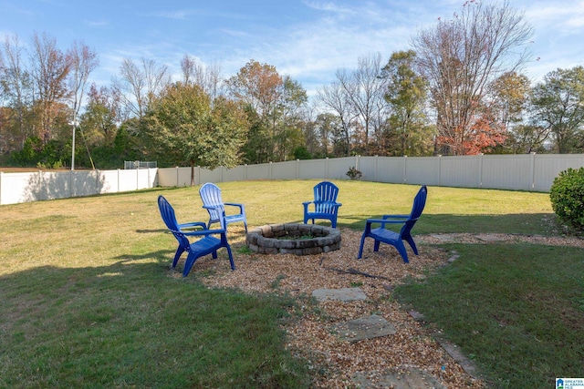 view of yard with a fire pit