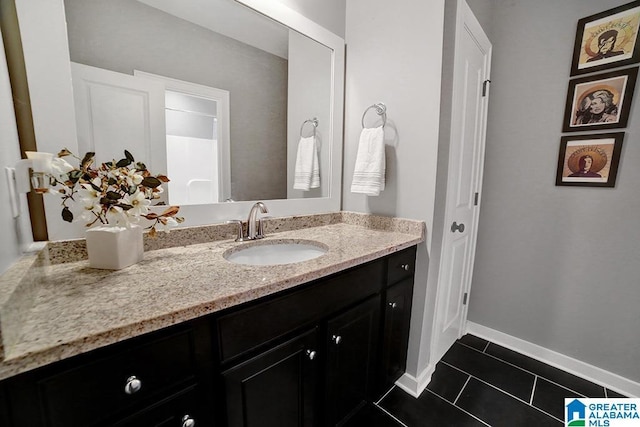 bathroom with tile patterned floors and vanity