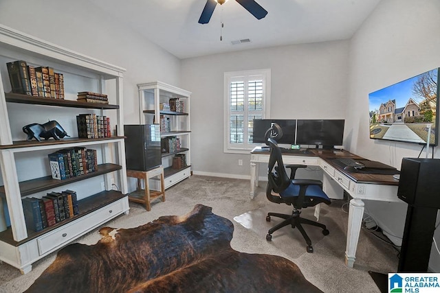 office featuring light carpet and ceiling fan