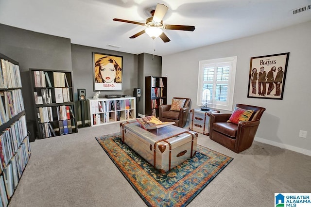 living area with carpet floors and ceiling fan