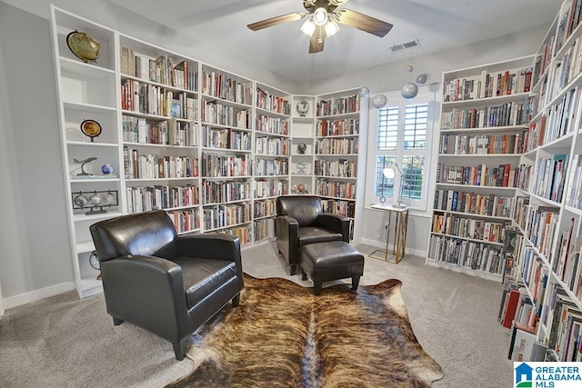 sitting room featuring ceiling fan and light carpet