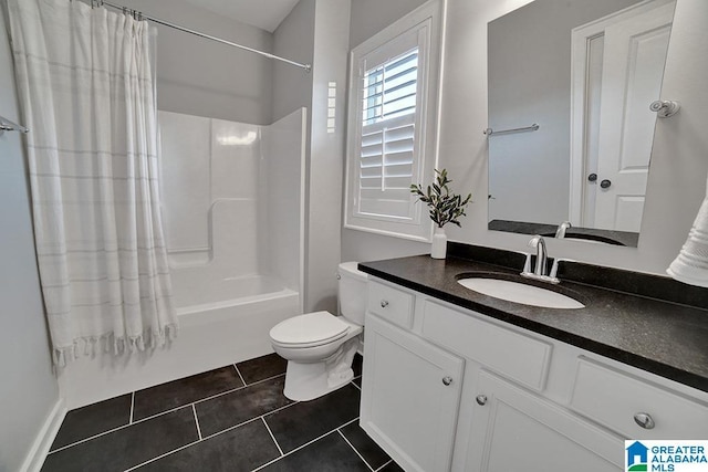 full bathroom with tile patterned flooring, vanity, toilet, and shower / bath combo with shower curtain