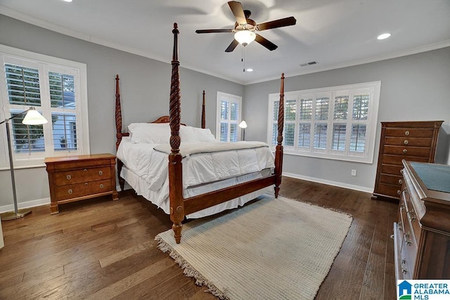 bedroom featuring ceiling fan, dark hardwood / wood-style floors, and crown molding