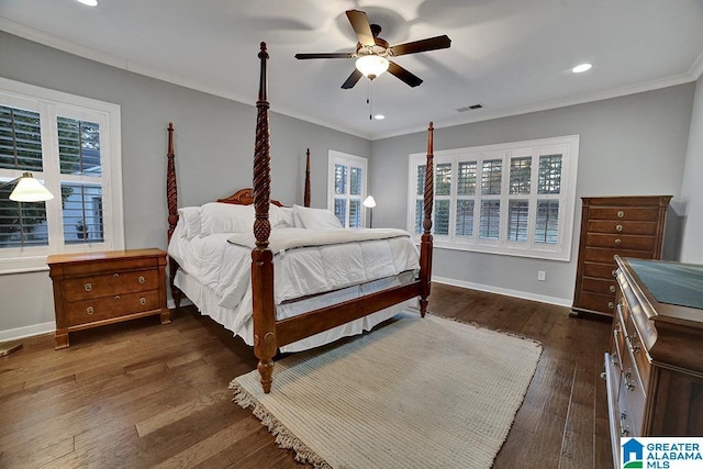 bedroom featuring ceiling fan, dark hardwood / wood-style floors, crown molding, and multiple windows